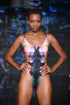 Model having Satellite Island One Piece in Galaxy Reversible, Cut Out Design, Front Zip, Lace Back Detail, BBA