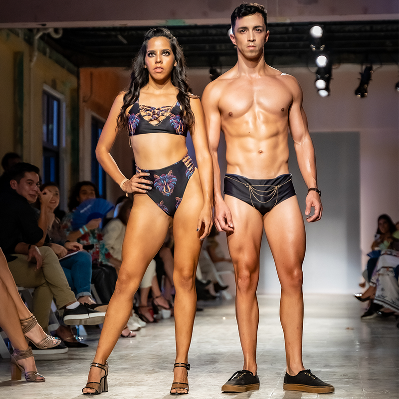 Model on Ramp Walk having Byron Bay Reversible Bikini in Festival Wolf, along with a Male Model