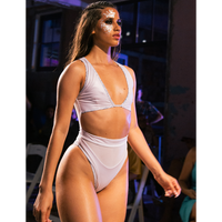 Model on a ramp walk having reversed Hayman Island One Piece in Animale Glitterati Reversible, Plunging neckline, High waist cheeky cut bottom, Fully reversible zipper and mesh back detailing, BBA
