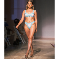 Model on a ramp walk, having Magnetic Island Bikini in Animale Glitterati Reversible, High waist cheeky cut bottom Tie front detail Braided adjustable strap Side braid bottom detail, BBA