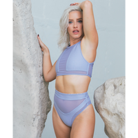 Model with white hair, having Whitehaven High Waisted Bikini in Animale Reversible, High waist with cheeky cut bottom High neck back zip crop top, BBA